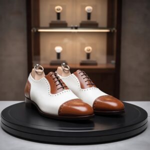 Two-tone white and brown wingtip Oxford dress shoes for men